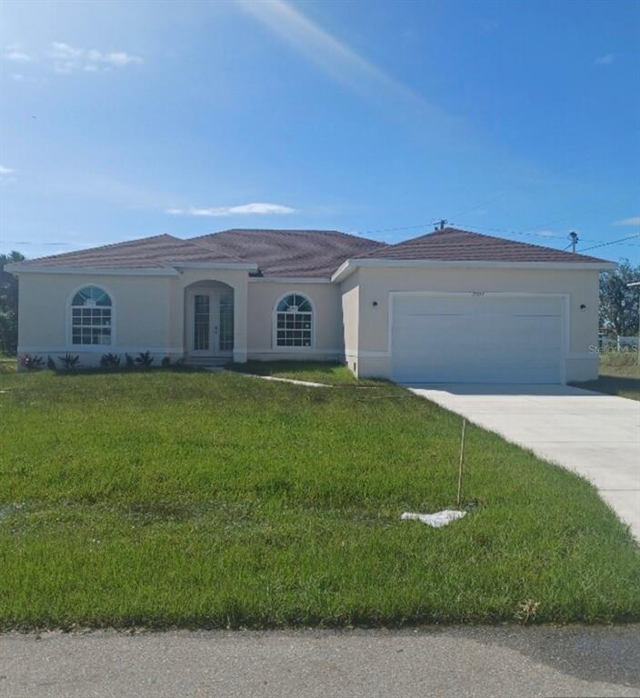 a view of front of house with a yard