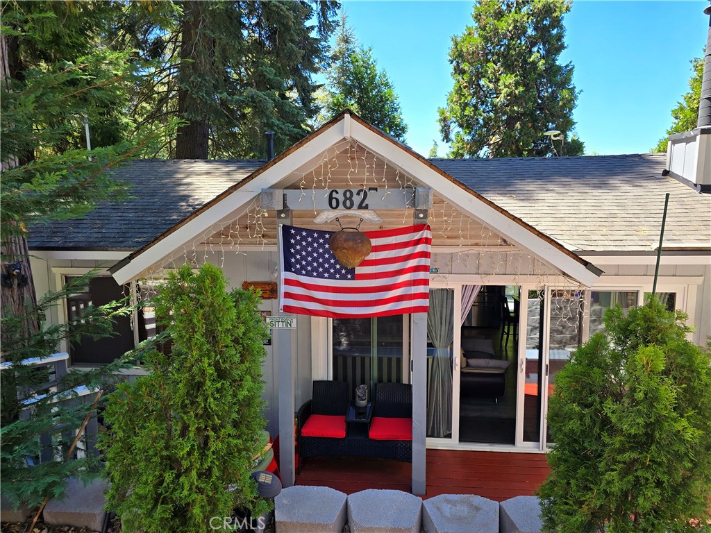 a view of a house with porch and sitting area