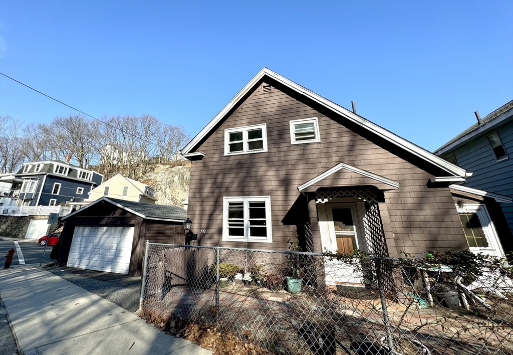 a front view of a house with yard