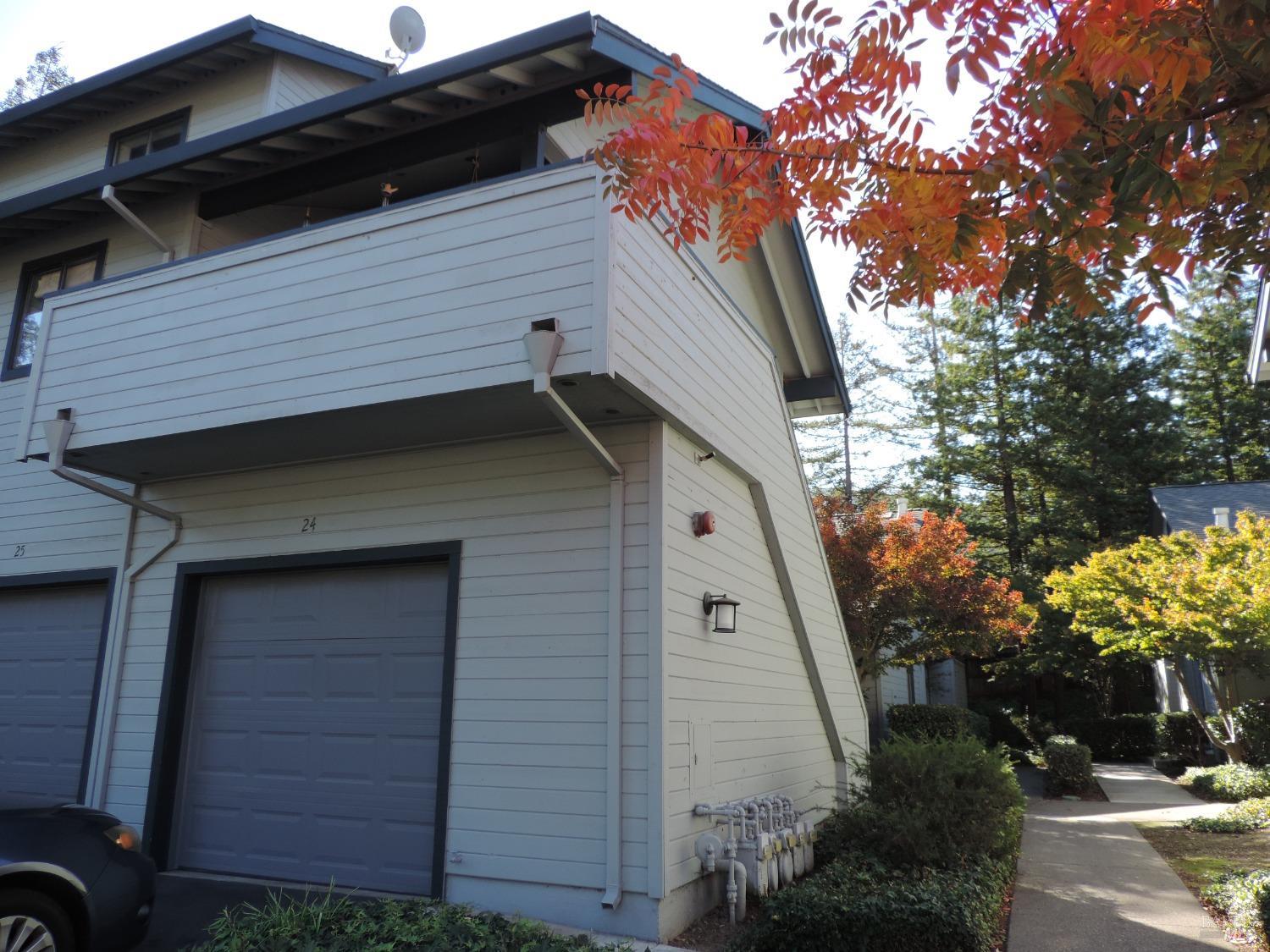 a view of house with a tree