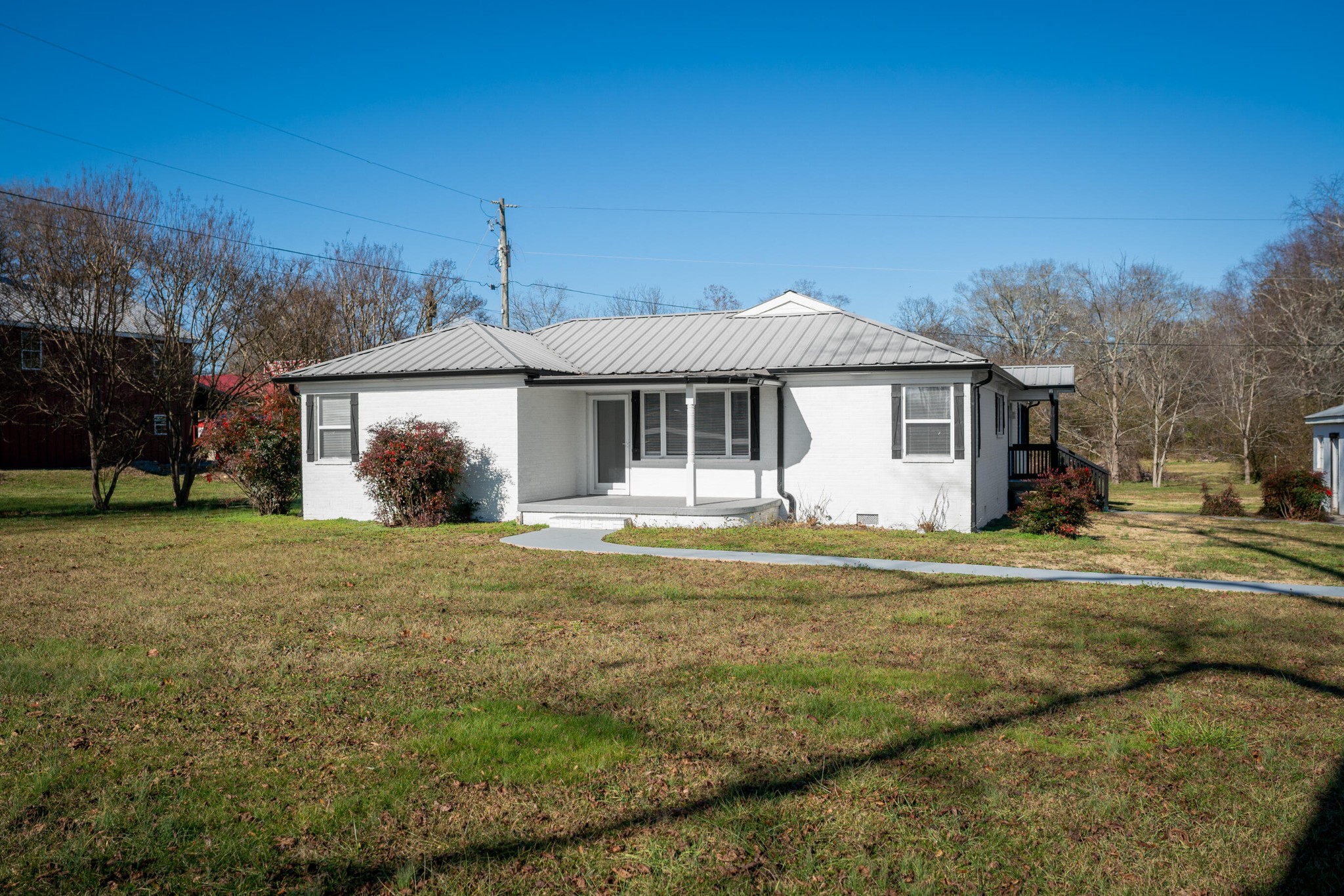 a front view of a house with a garden