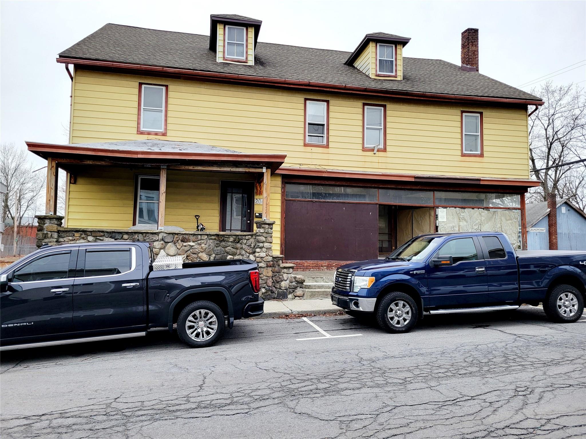 a view of a car parked in front of a house