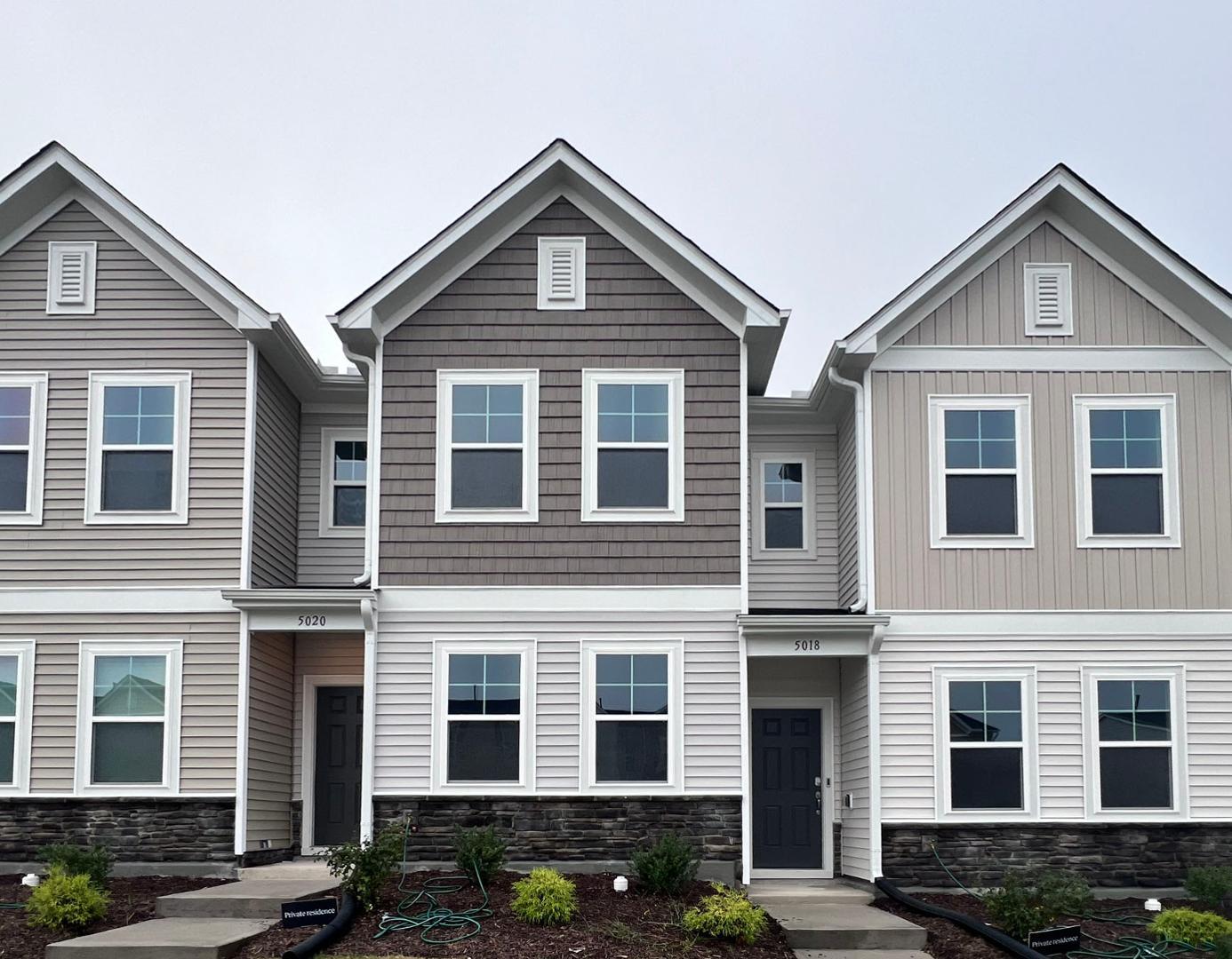 a front view of residential houses