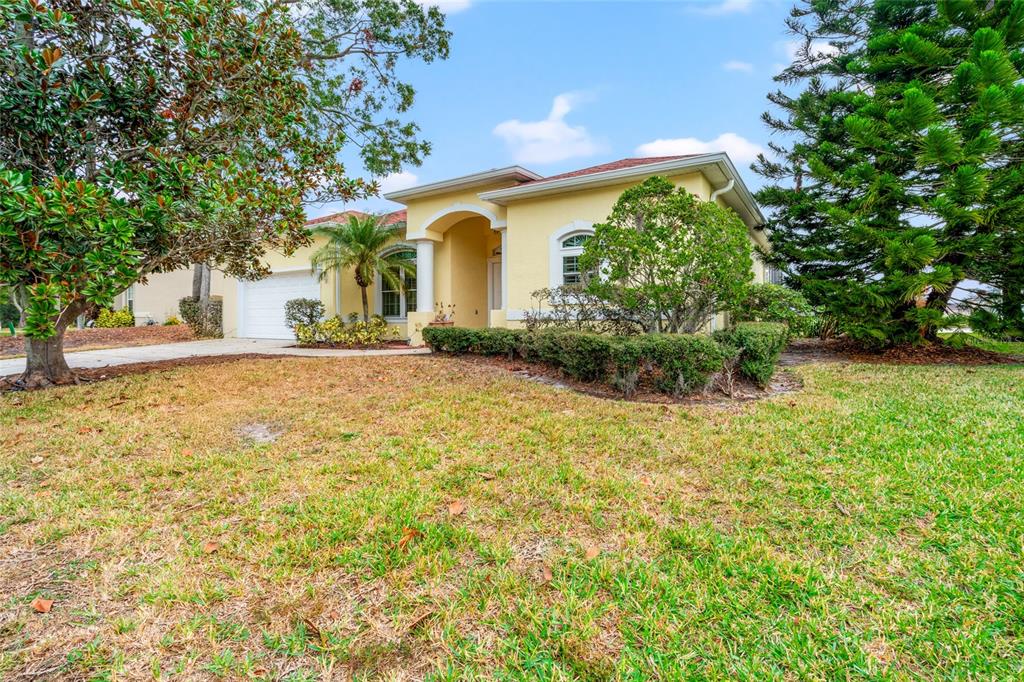 a front view of a house with a yard