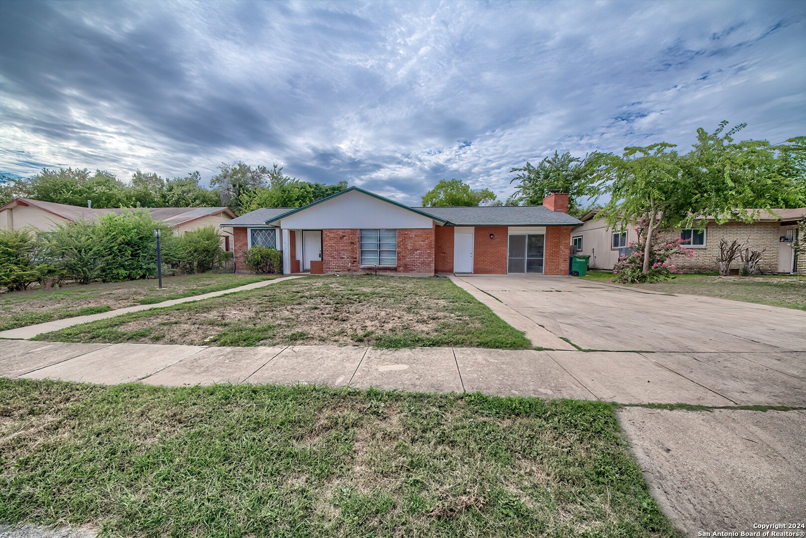 front view of a house with a yard