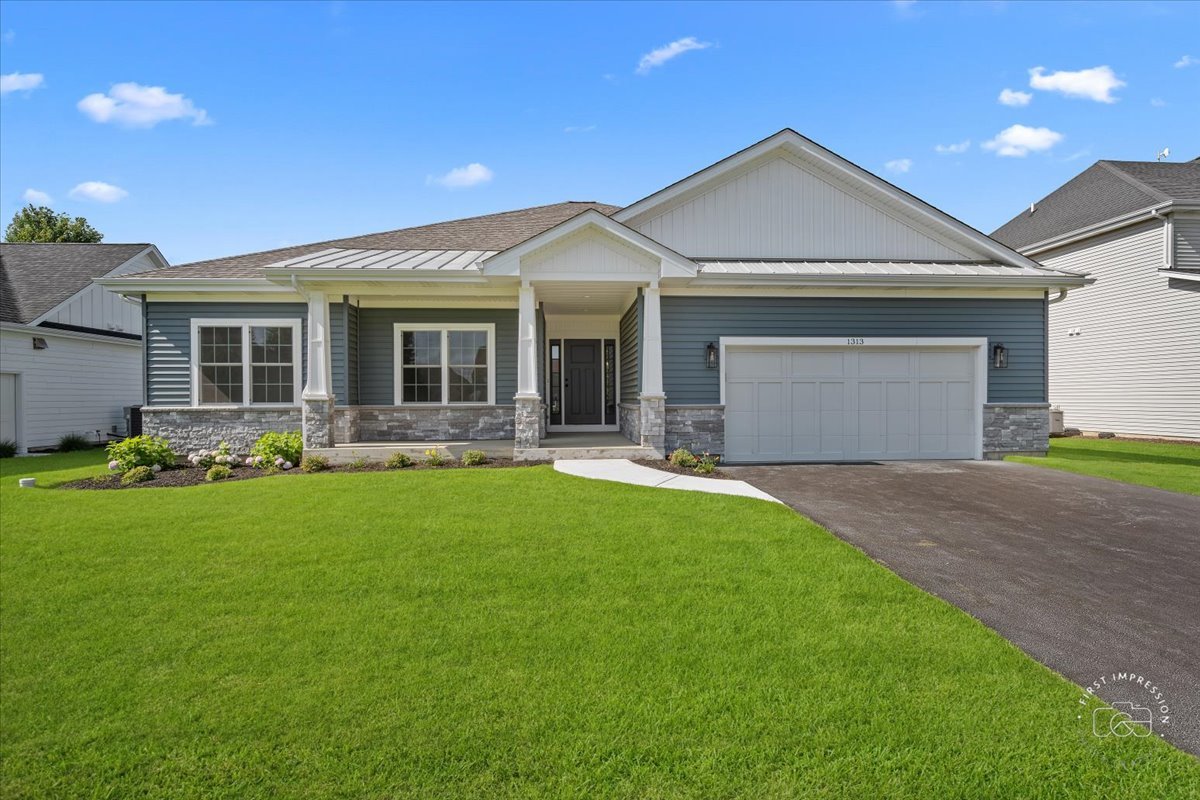 a front view of house with yard and green space