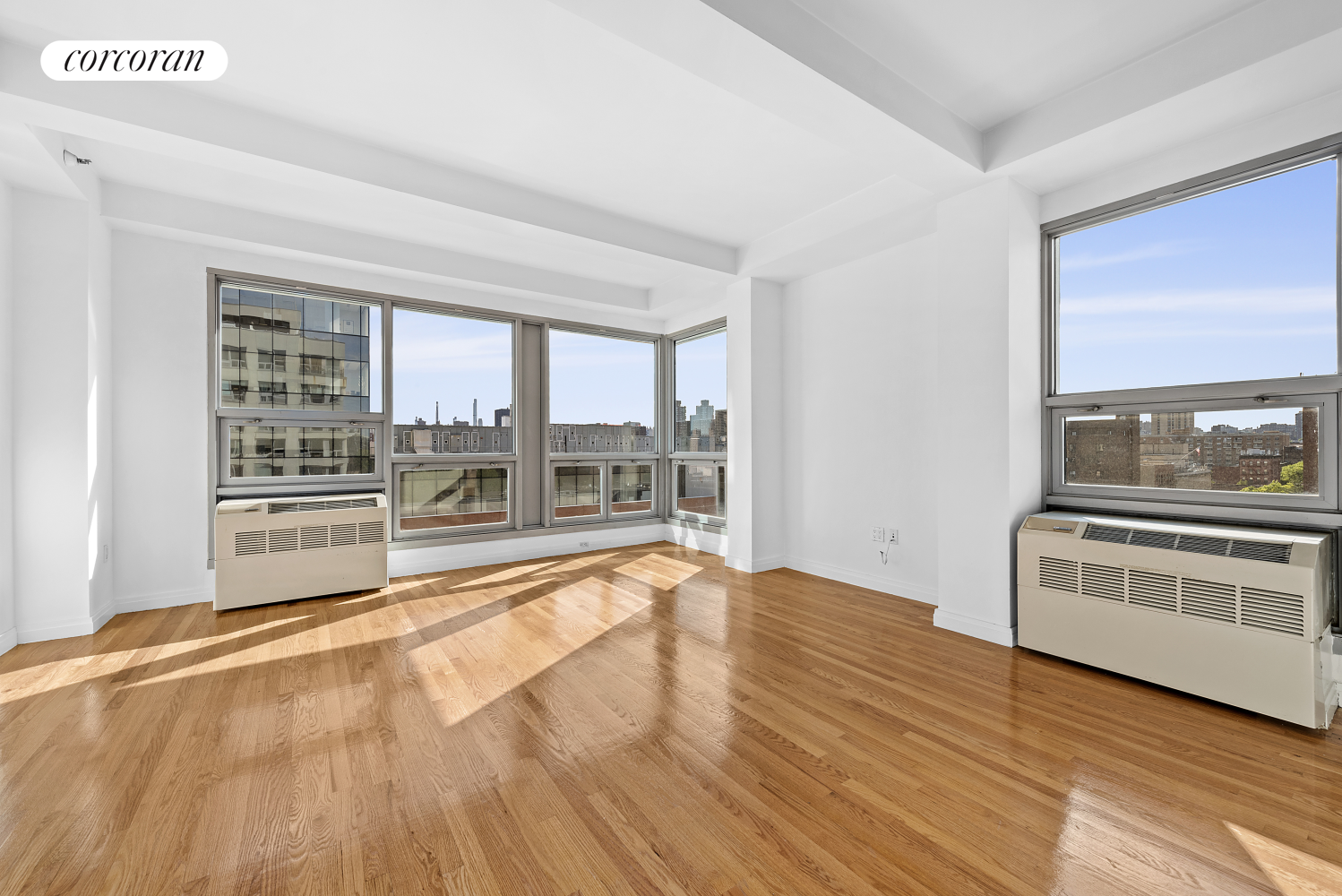 a view of an empty room with a kitchen stove back oven cabinets and a kitchen counter top