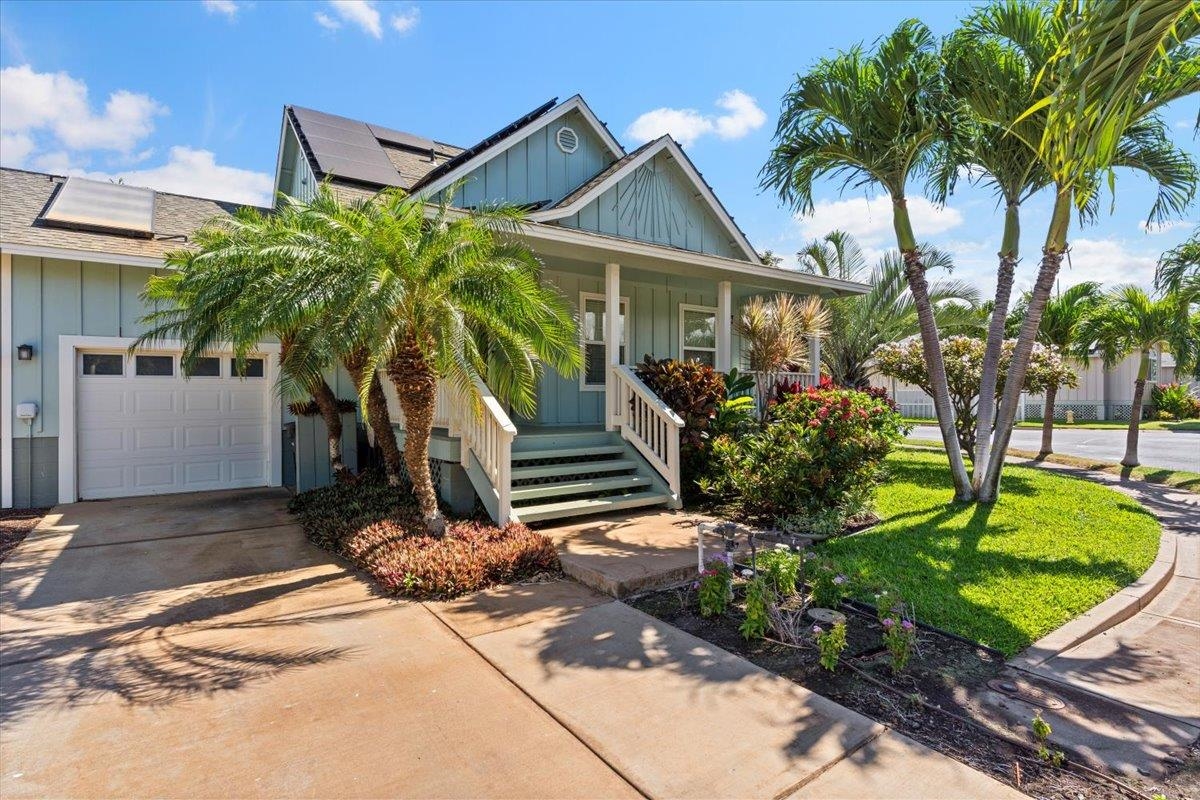 a front view of a house with garden