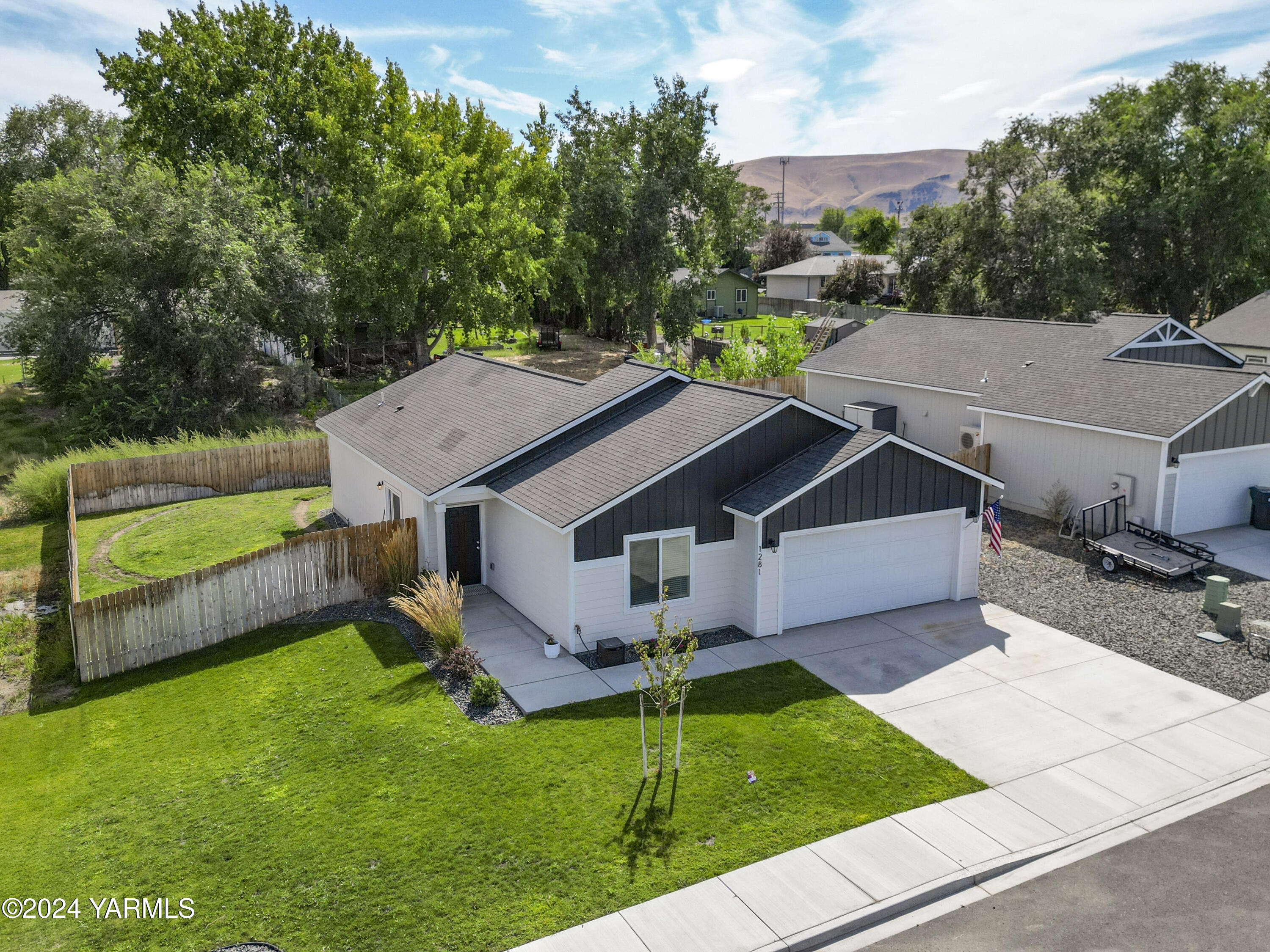 aerial view of a house with a yard