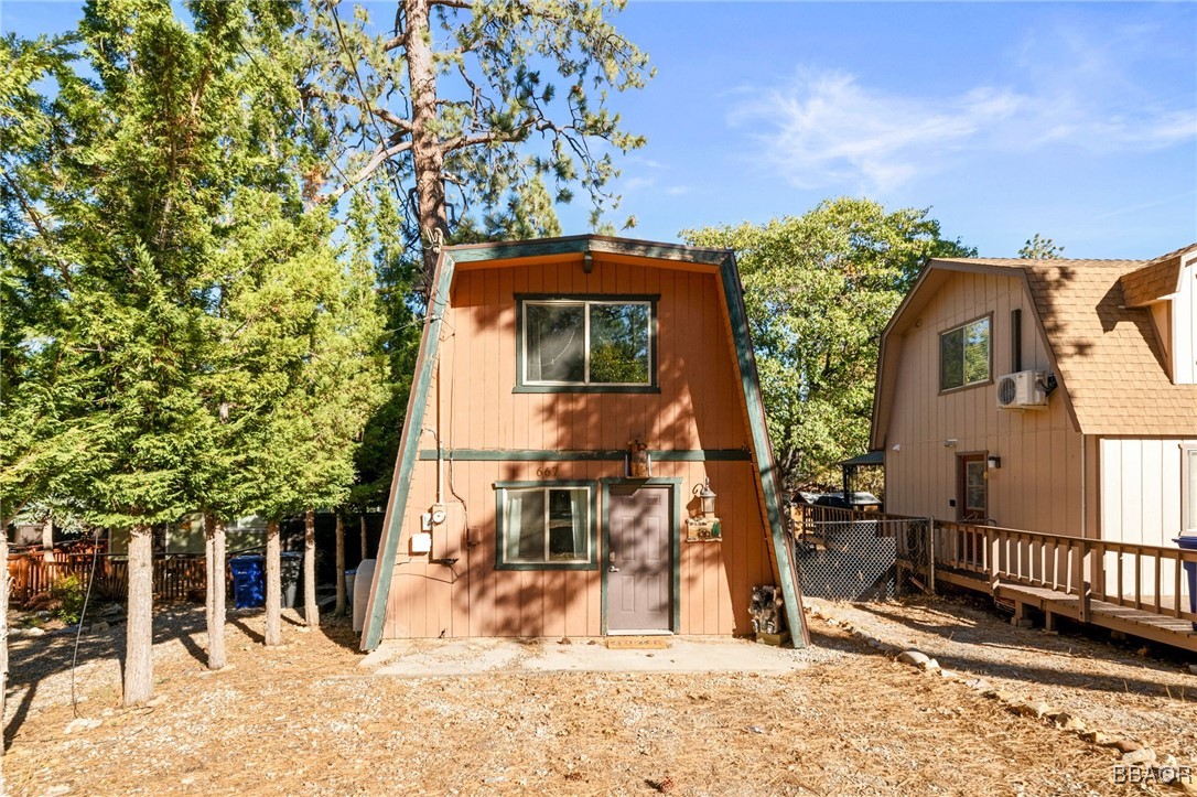 a view of a house with a tree