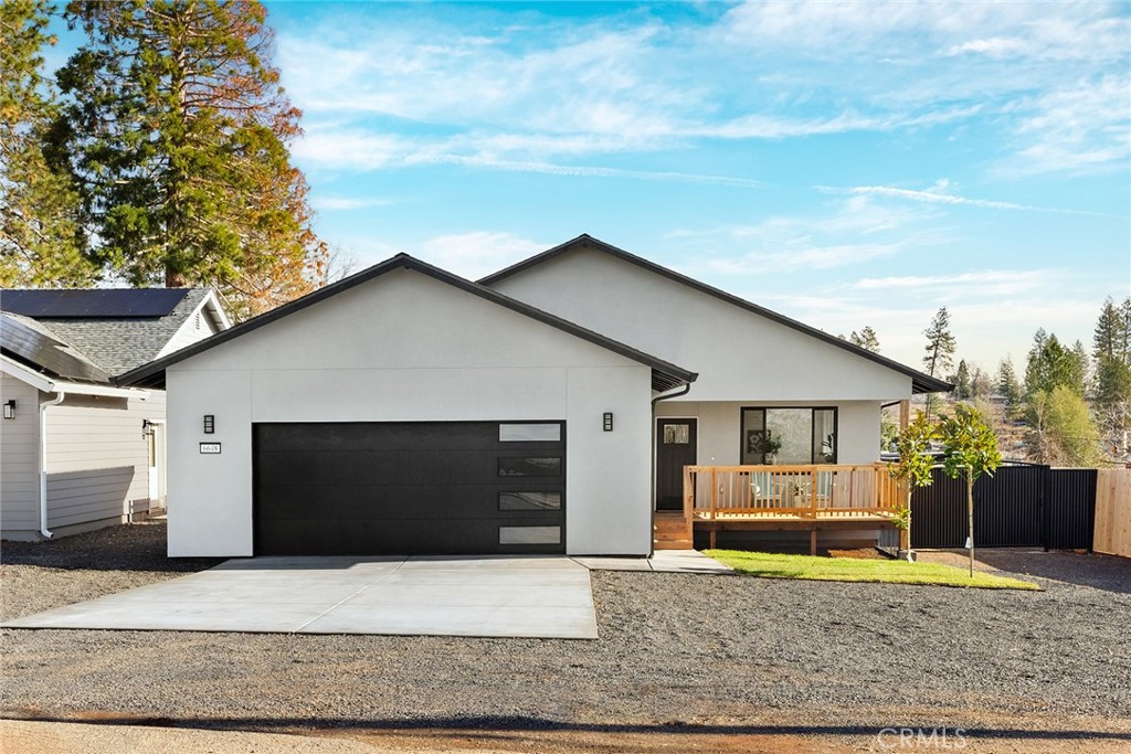 a front view of house with garage