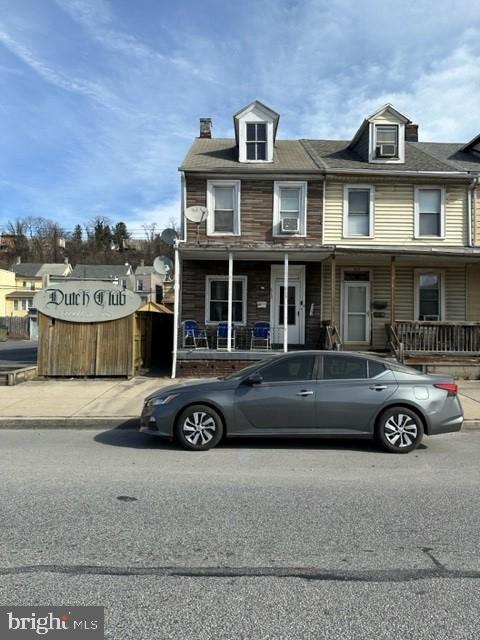 a front view of a house with parking space