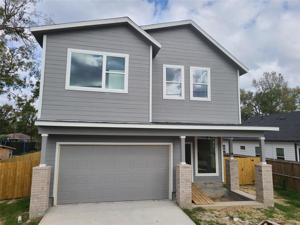 a front view of house with parking space