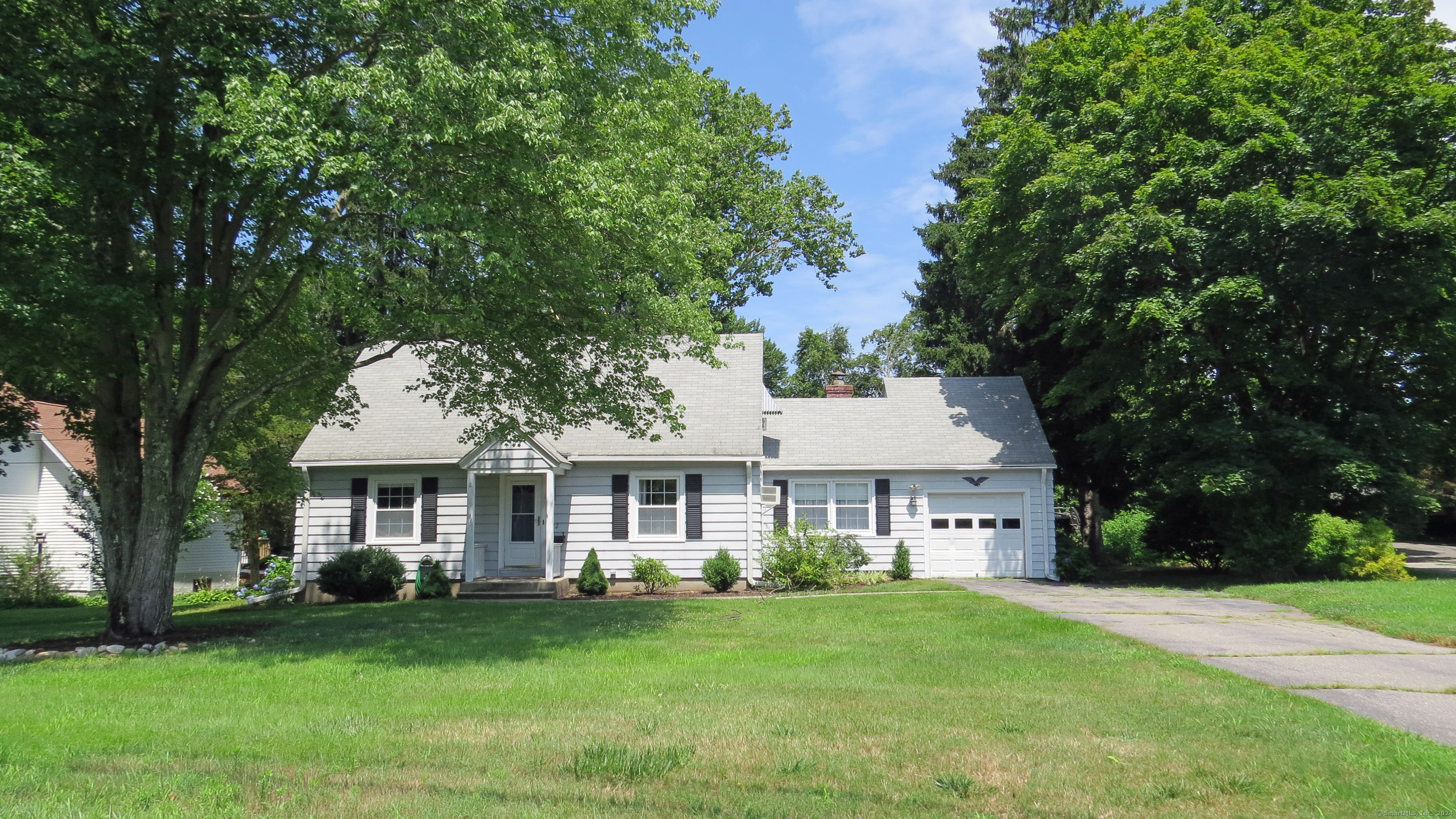 front view of a house with a yard