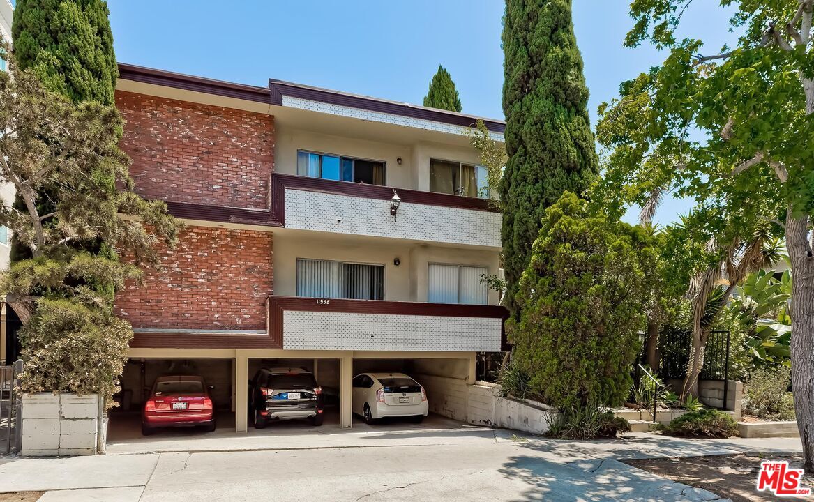 a front view of a house with parking