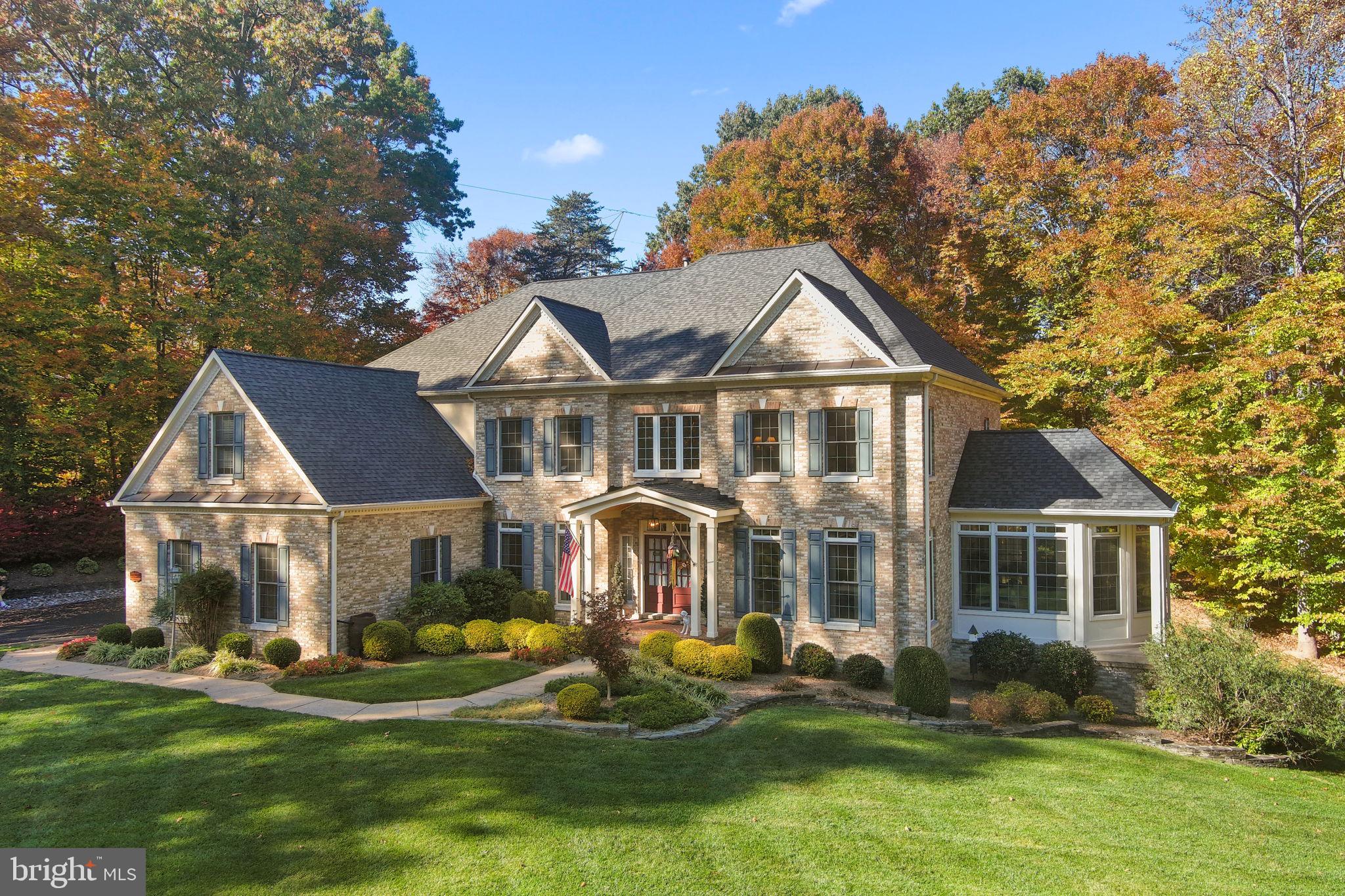 a front view of a house with a yard porch and sitting area