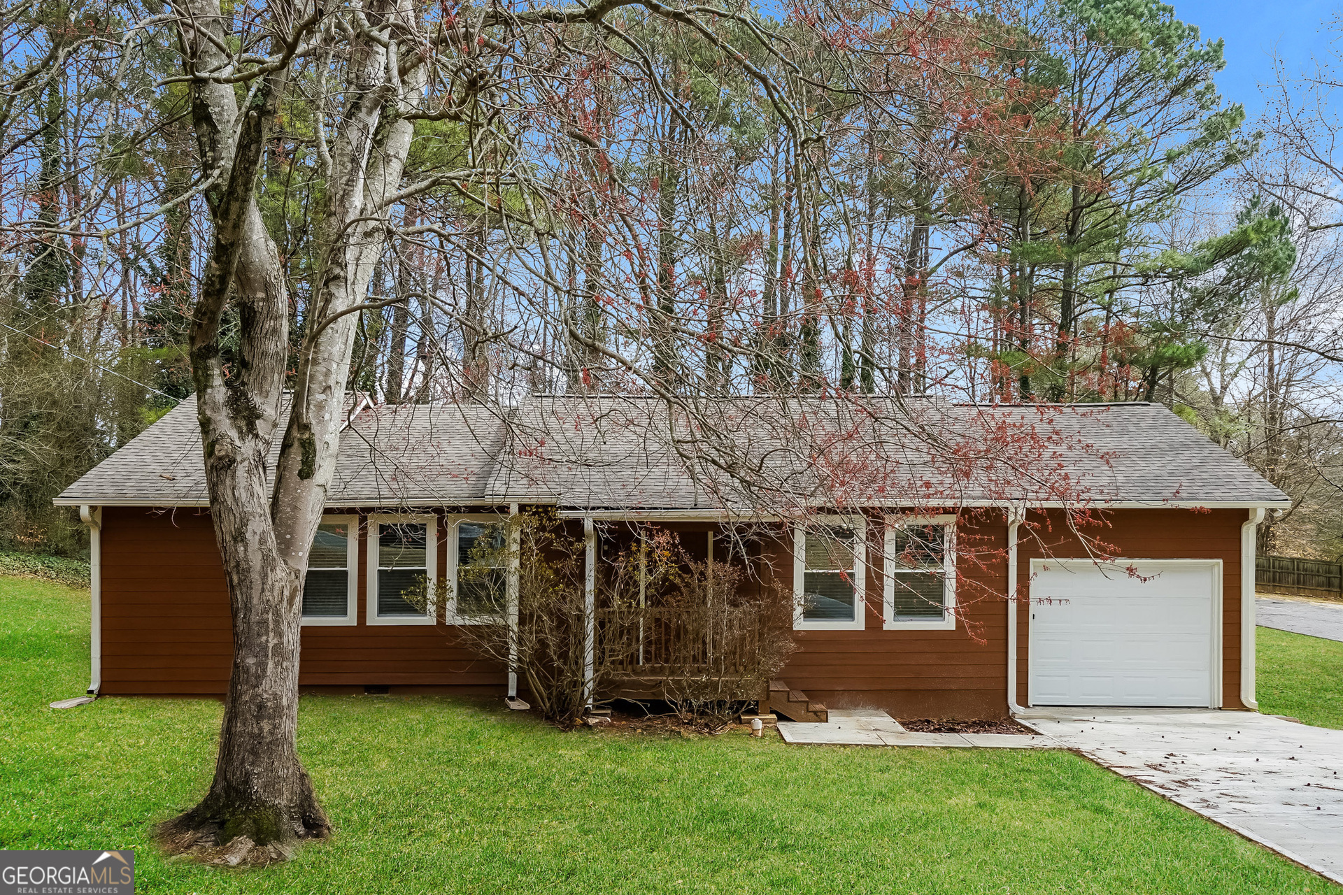 front view of a house with a yard