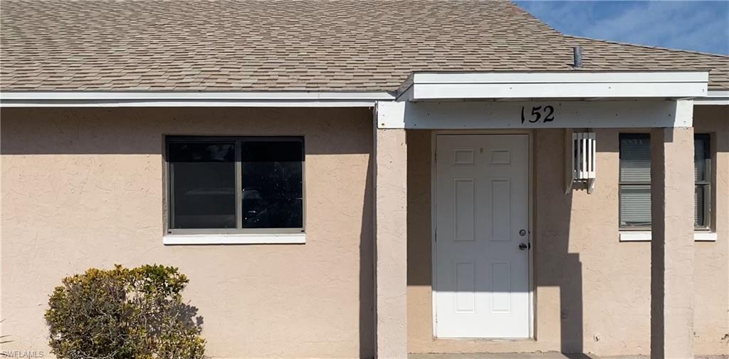 a front view of a house with a glass door