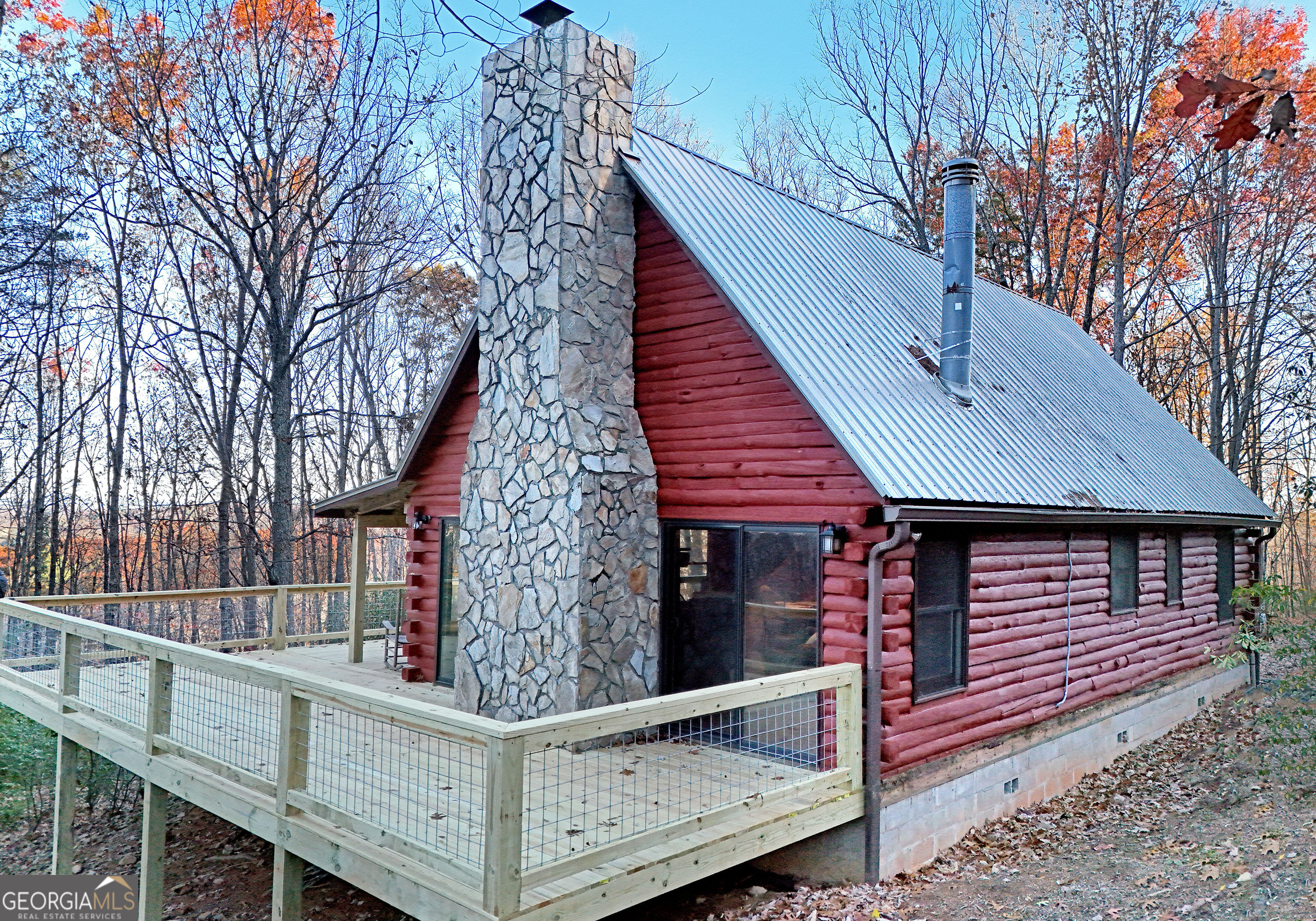 a front view of a house with wooden fence