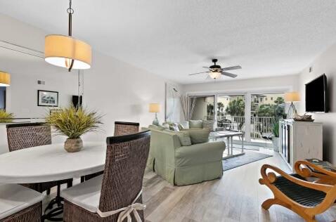 a view of a livingroom with furniture and a flat screen tv