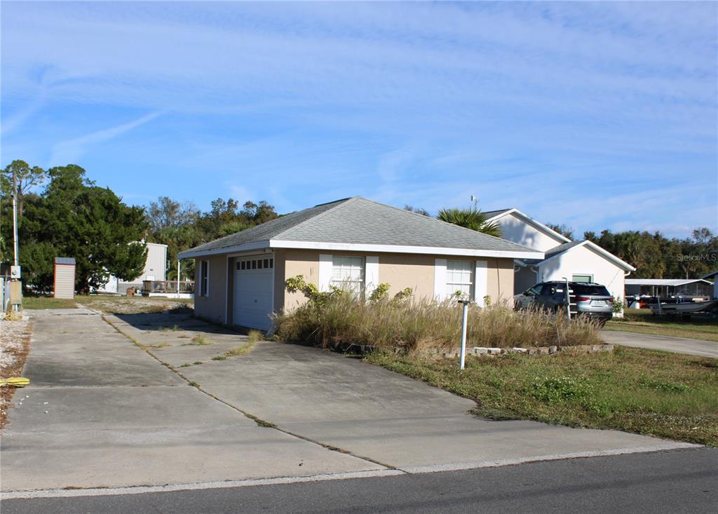 a view of a car park in front of house