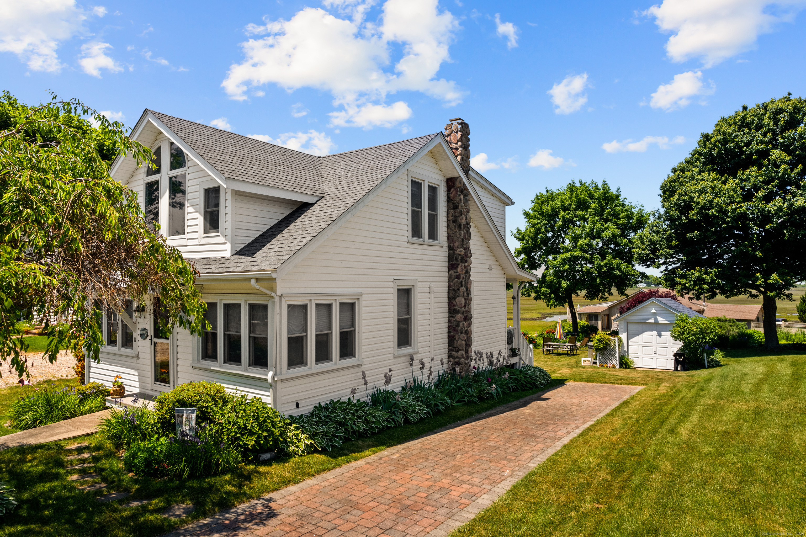 a view of house with yard