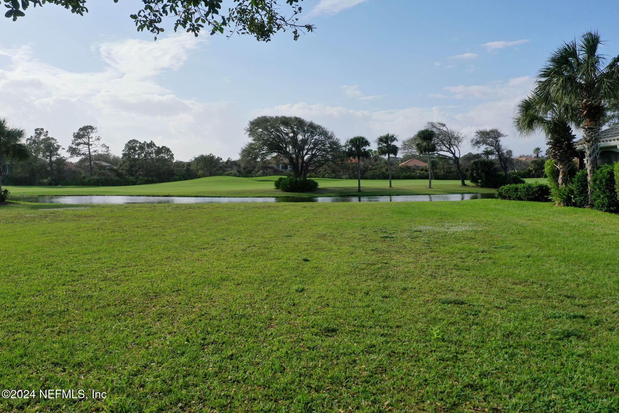 a view of a golf course with a lake