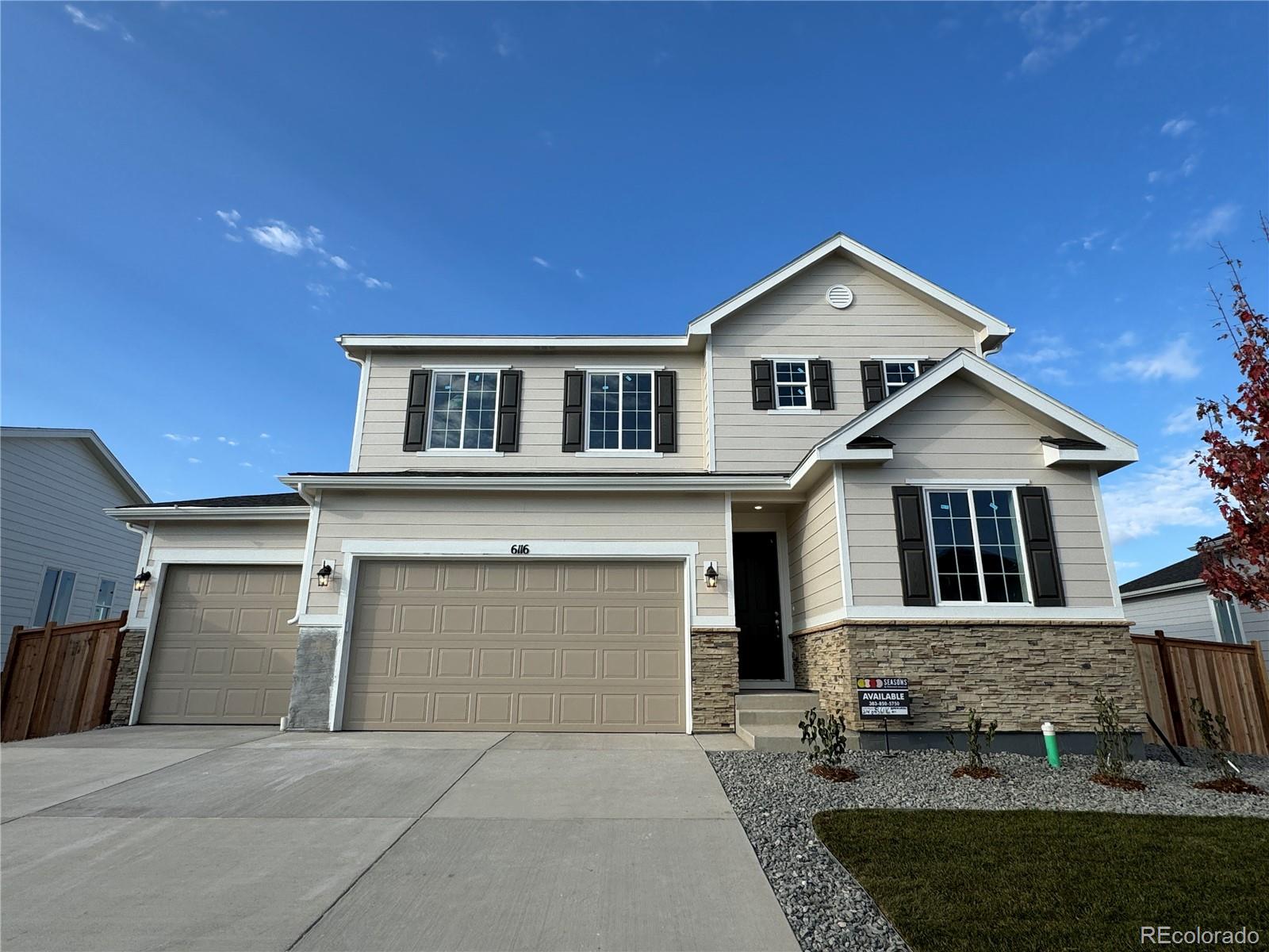 a front view of a house with garage