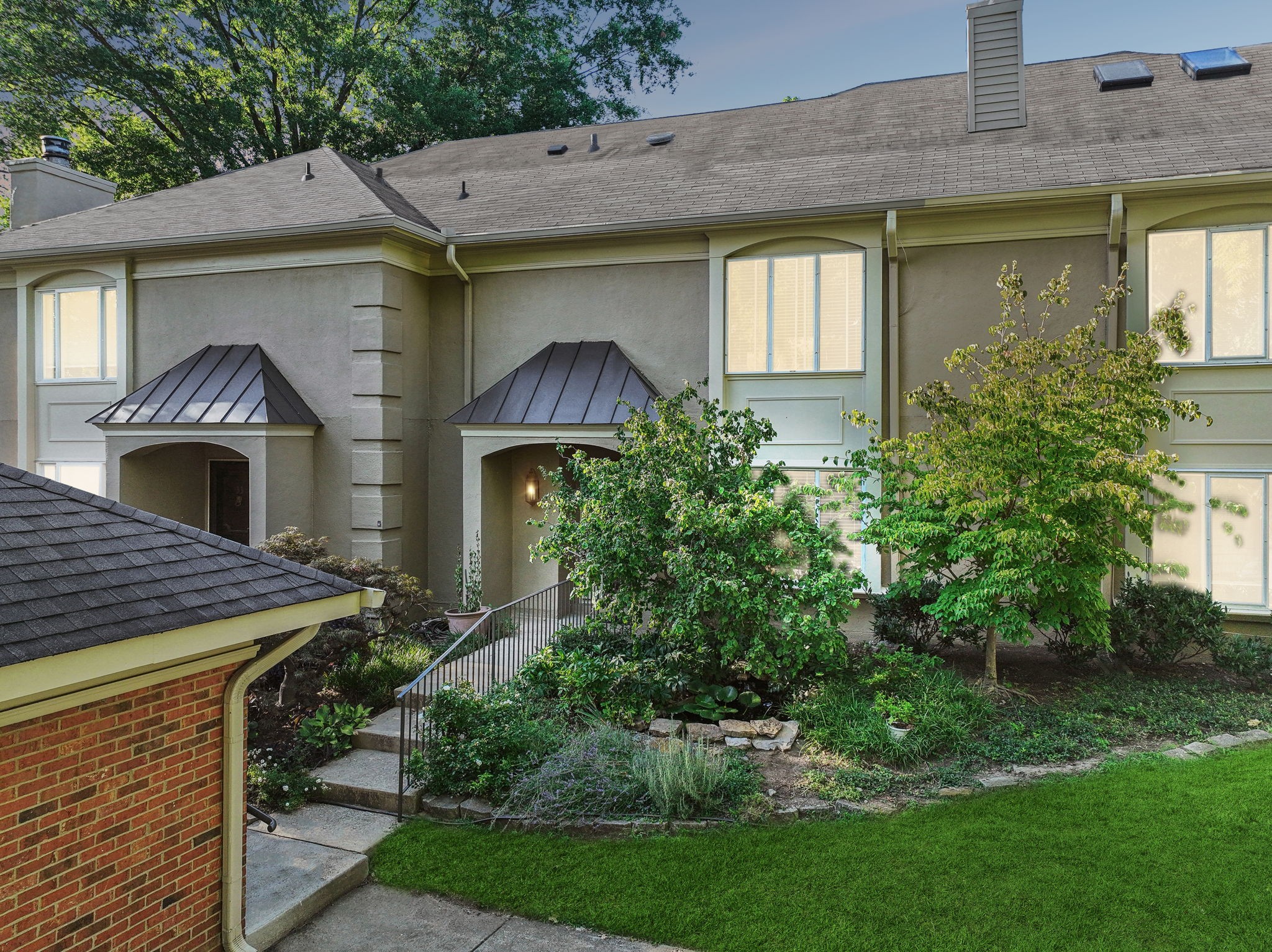 a house view with a garden space