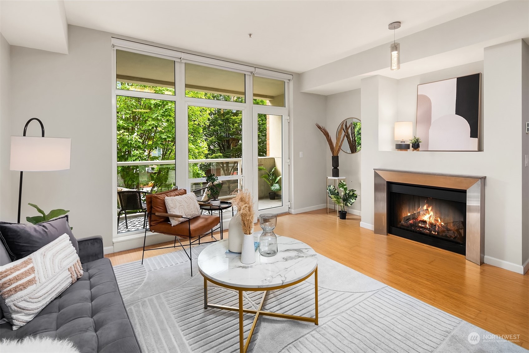 a living room with furniture and a fireplace