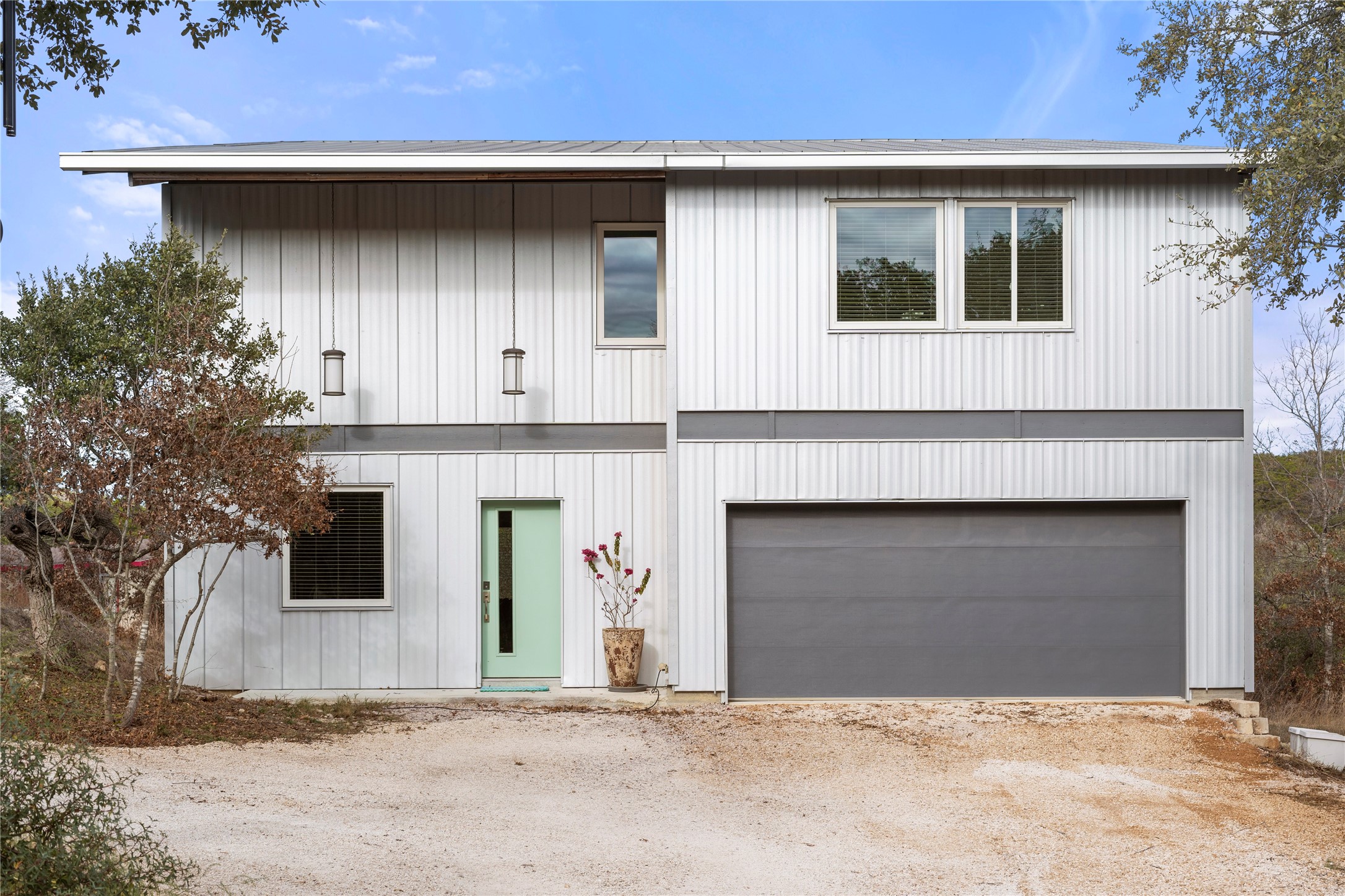 a front view of a house with garage