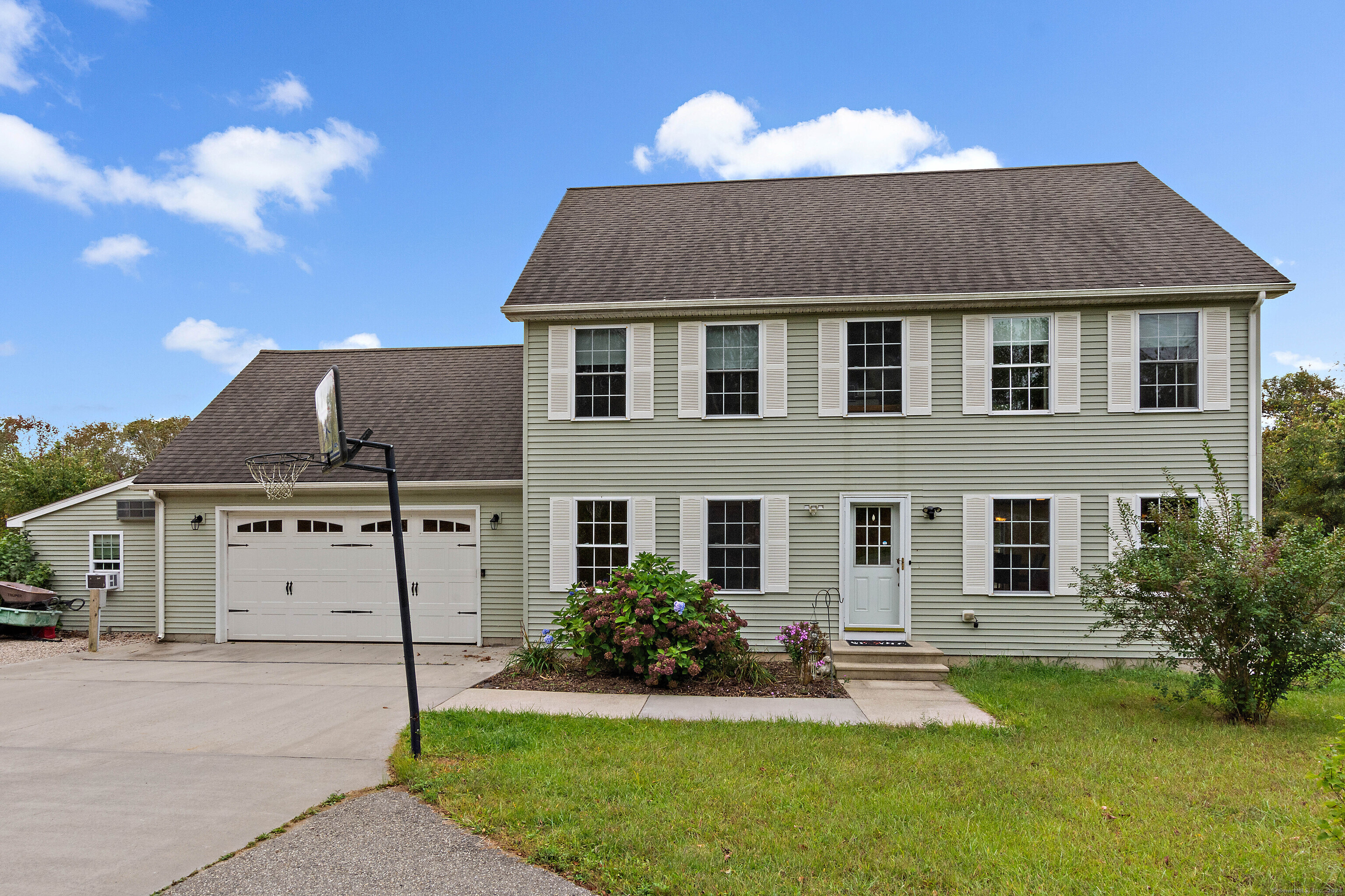 front view of a house with a yard