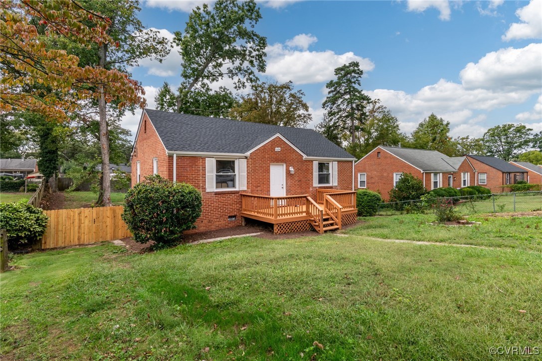 a view of a house with backyard porch and sitting area