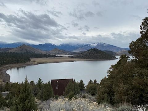 an aerial view of a house with a lake view