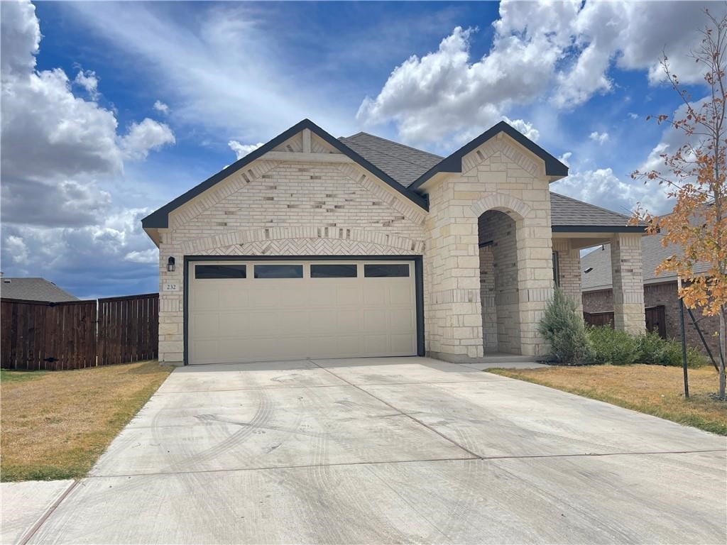 a front view of a house with a garage