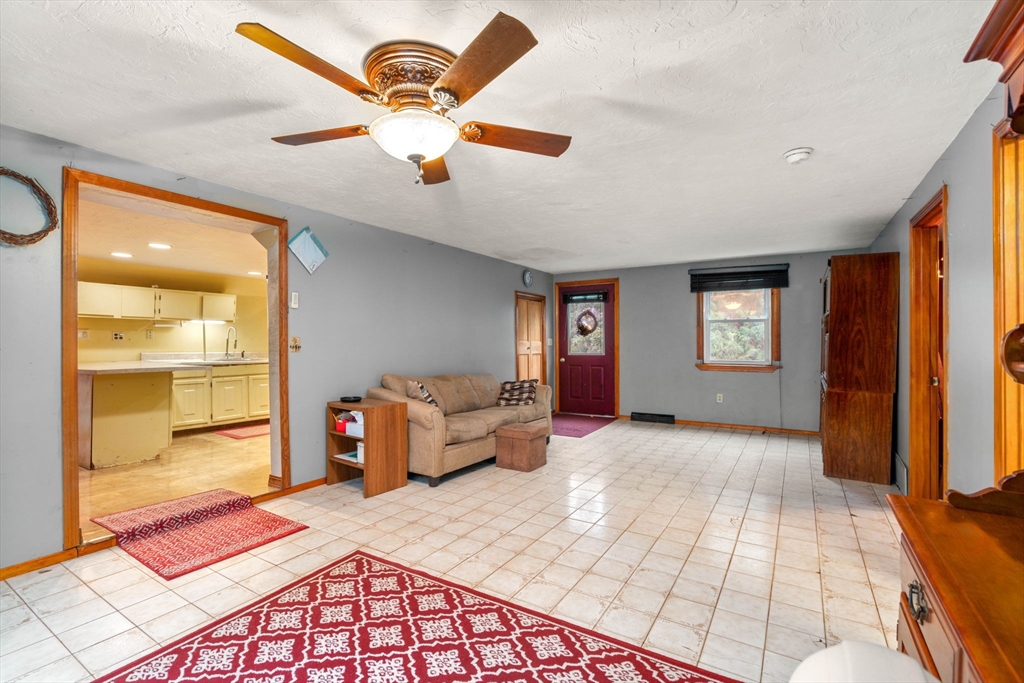 a bedroom with furniture and a window