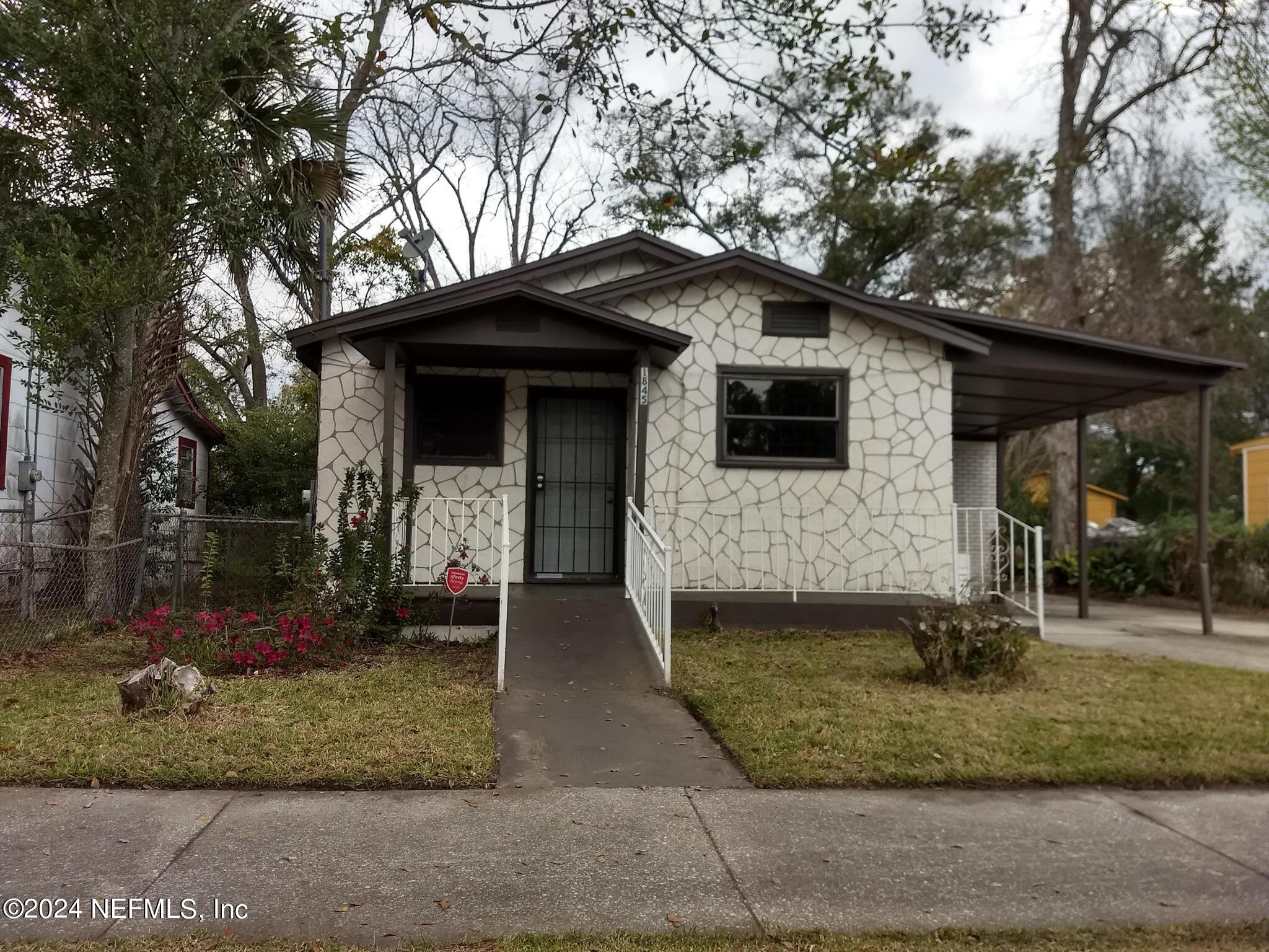 a front view of a house with garden