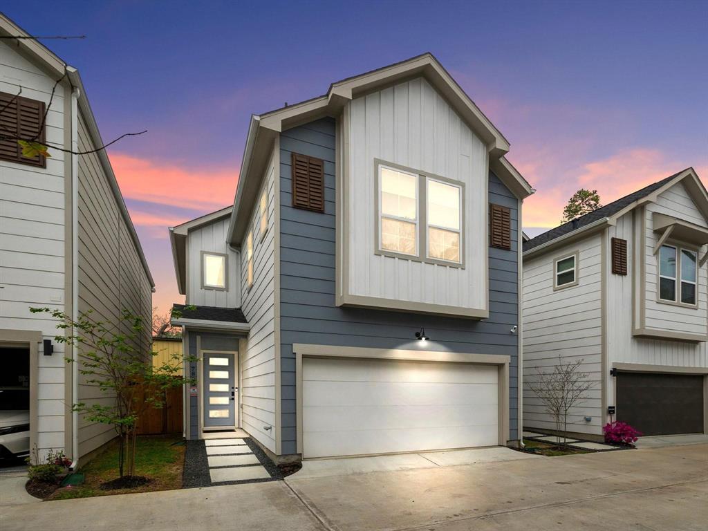 a front view of a house with a garage