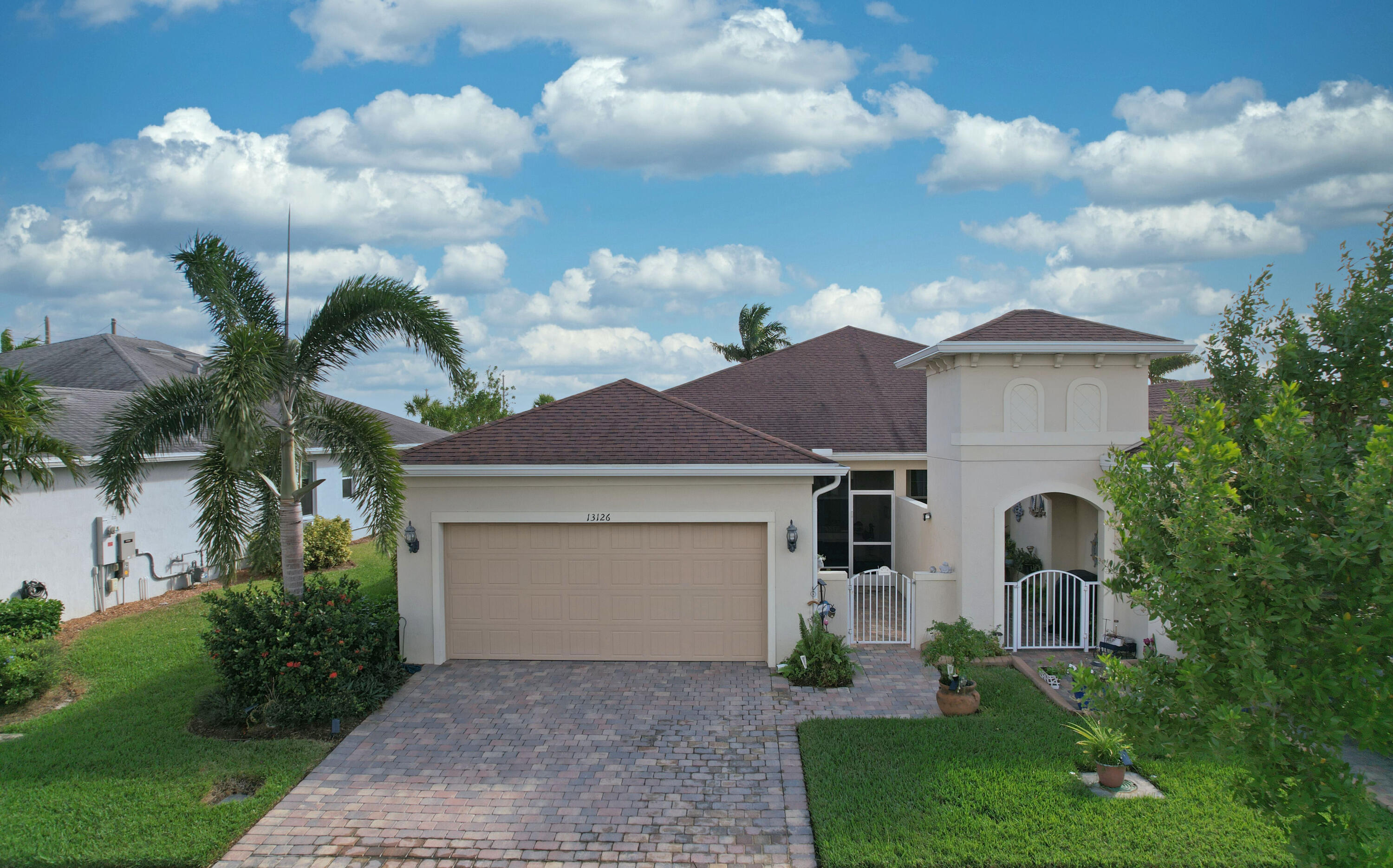 a front view of a house with garden