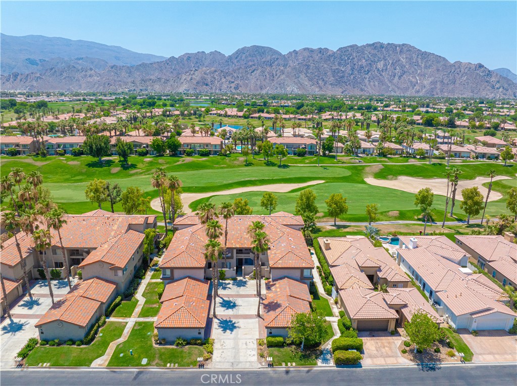 an aerial view of residential houses and outdoor space