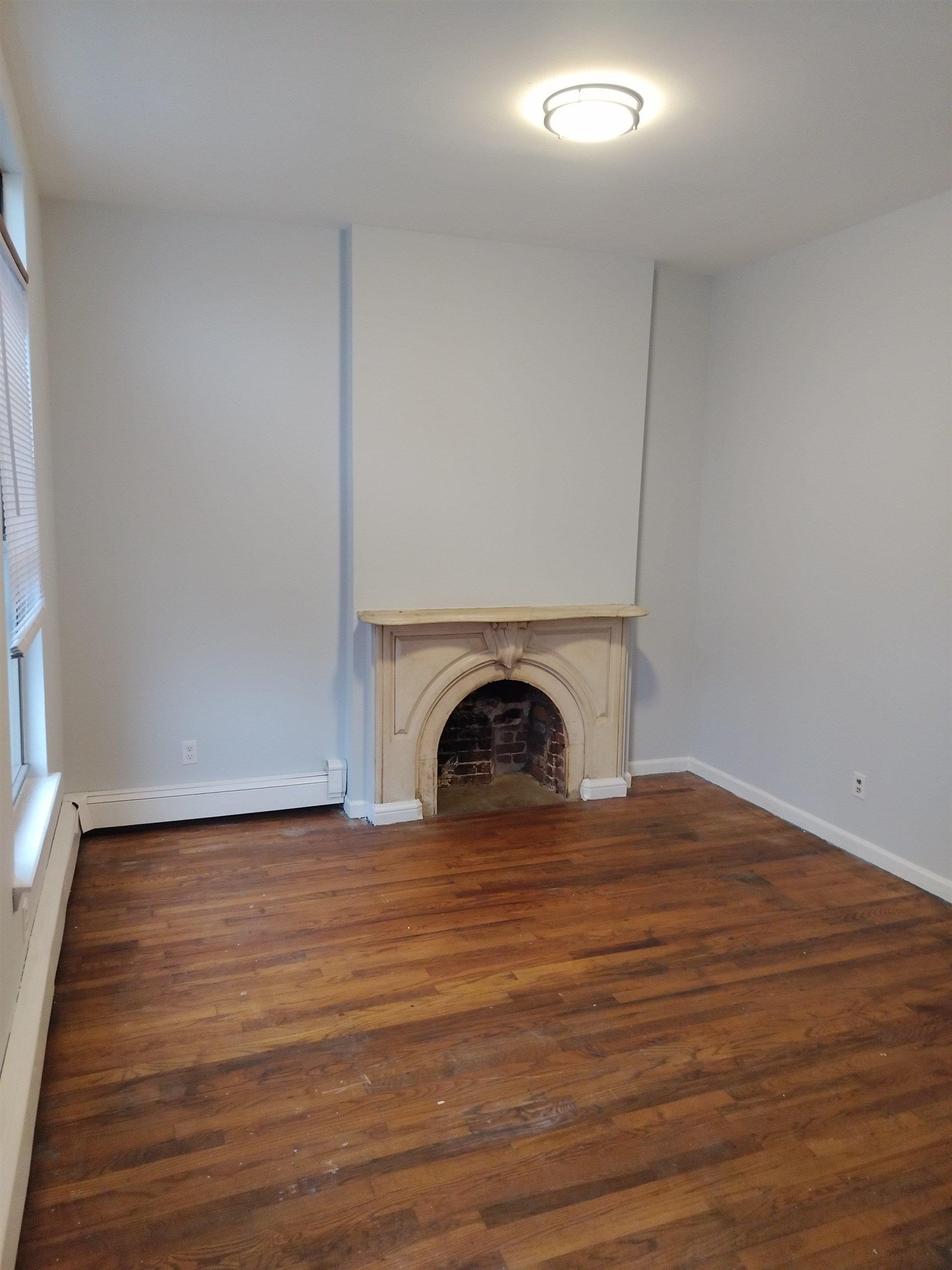 a view of a livingroom with wooden floor