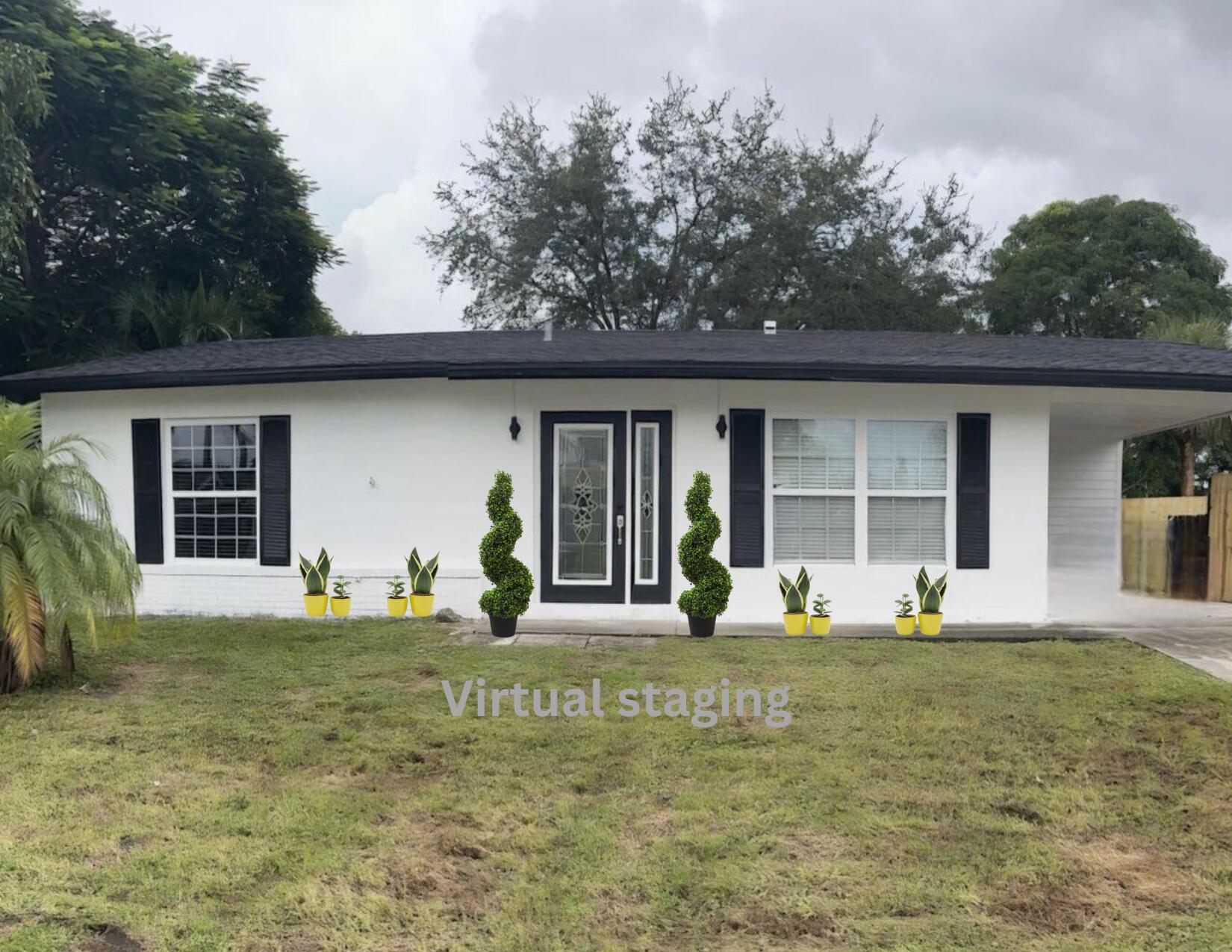 a front view of a house with a garden and trees