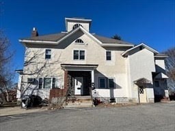 a front view of a house with a outdoor space