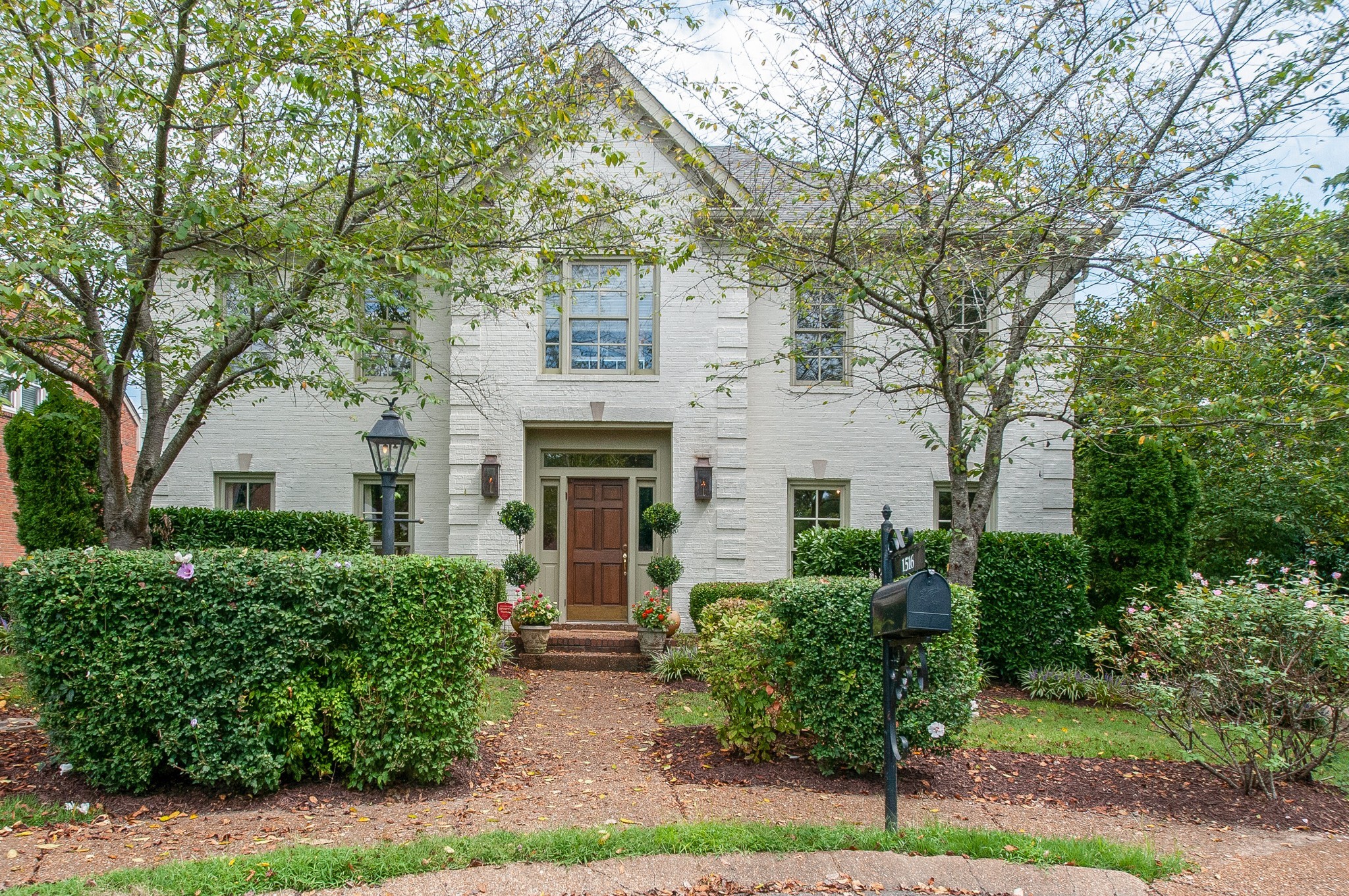 front view of a house with a garden