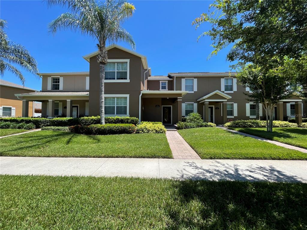 a front view of a house with a yard