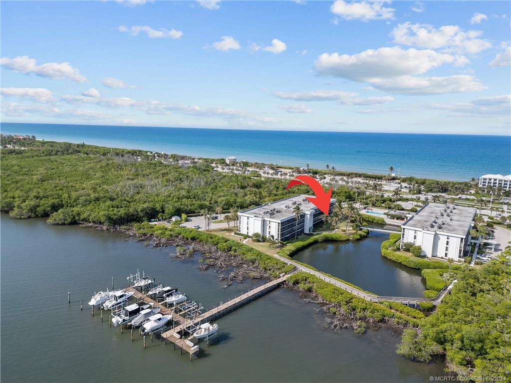 an aerial view of a house with a lake view