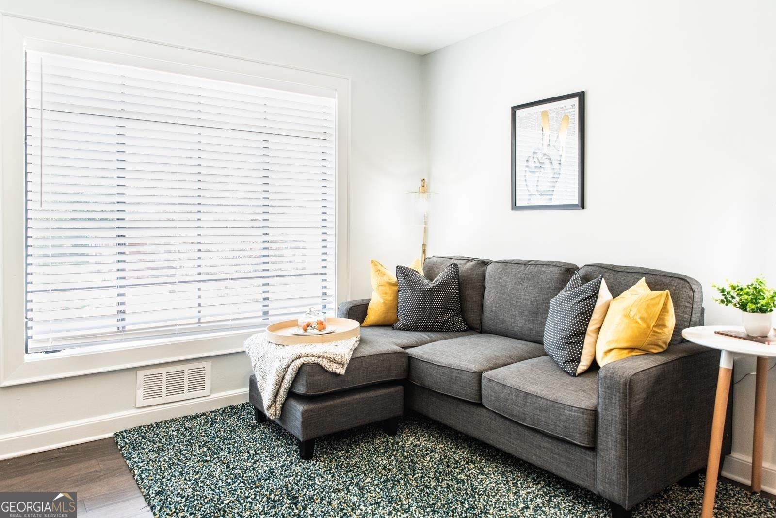 a living room with furniture and a window