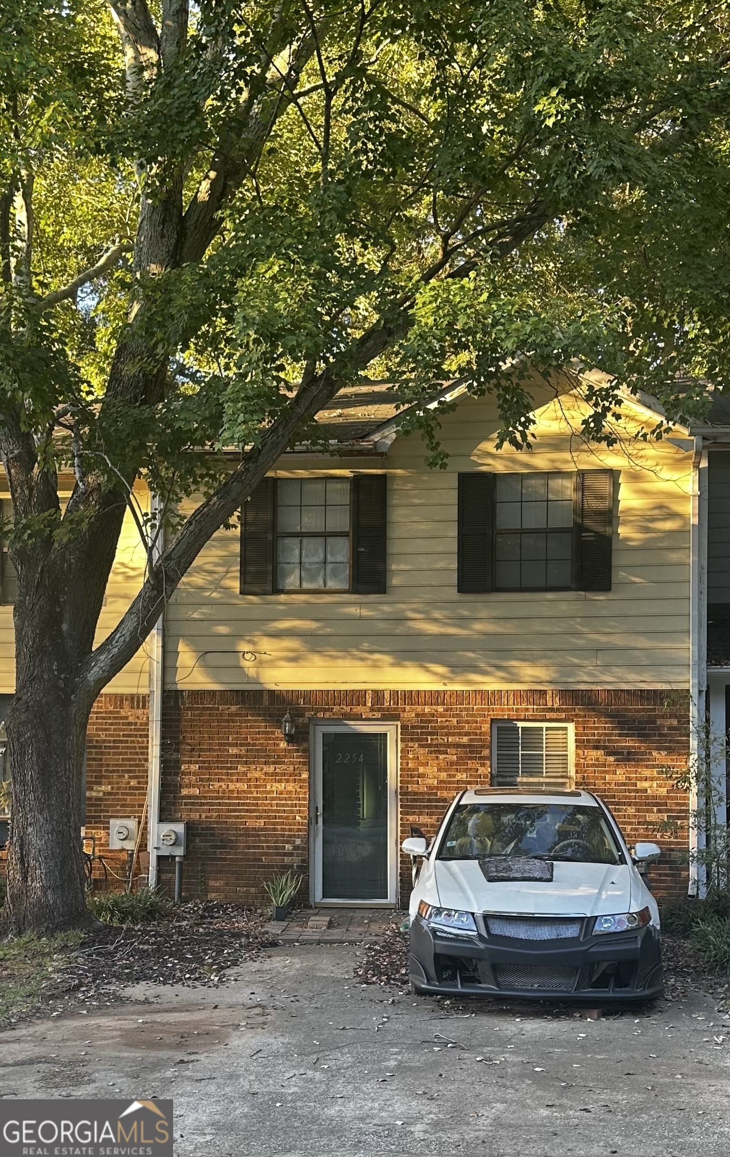 a car parked in front of a house