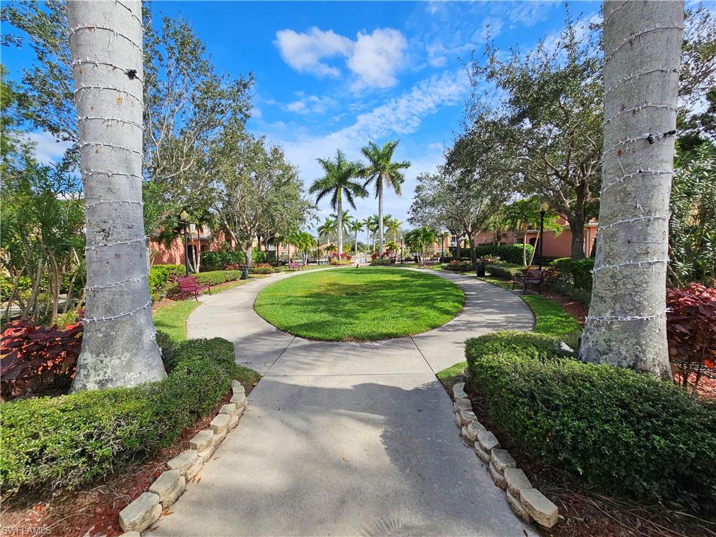 View of property's community featuring a lawn