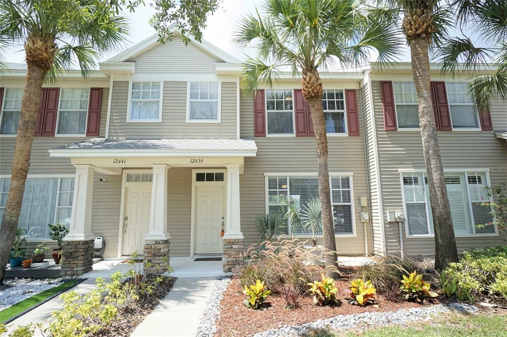 a front view of a house with a yard